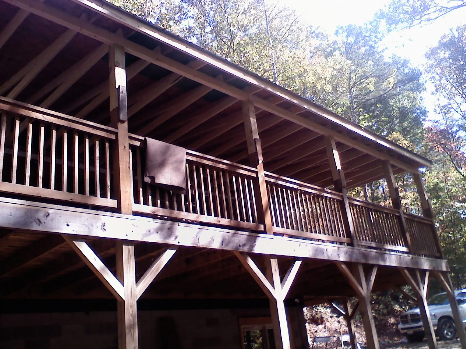 Timber framing under a new elevated porch and deck in West Union